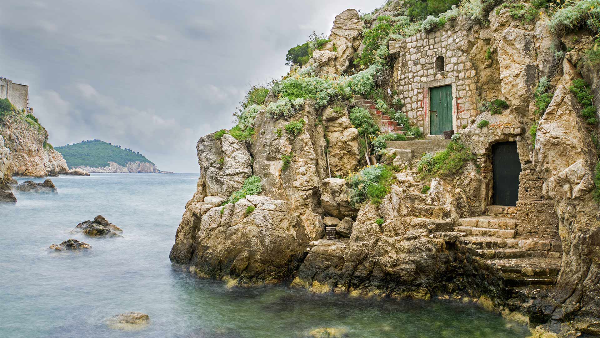 Wooden doors and a stone path at the base of Fort Lovrijenac in Kolorina Bay, Dubrovnik (© Barbara Vallance/Getty Images)(Bing Canada)