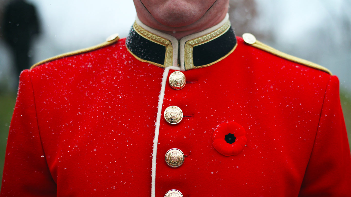 A member of the Canadian Armed Forces wears a poppy prior to a Remembrance Day ceremony (© Cole Burston/Xinhua Press/Corbis)(Bing Canada)