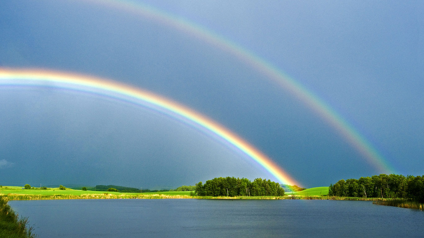 Prairie slough with farmland and rainbow in the background, near Bruxelles, Manitoba (© David Reede/All Canada Photos/Getty Images)(Bing Canada)