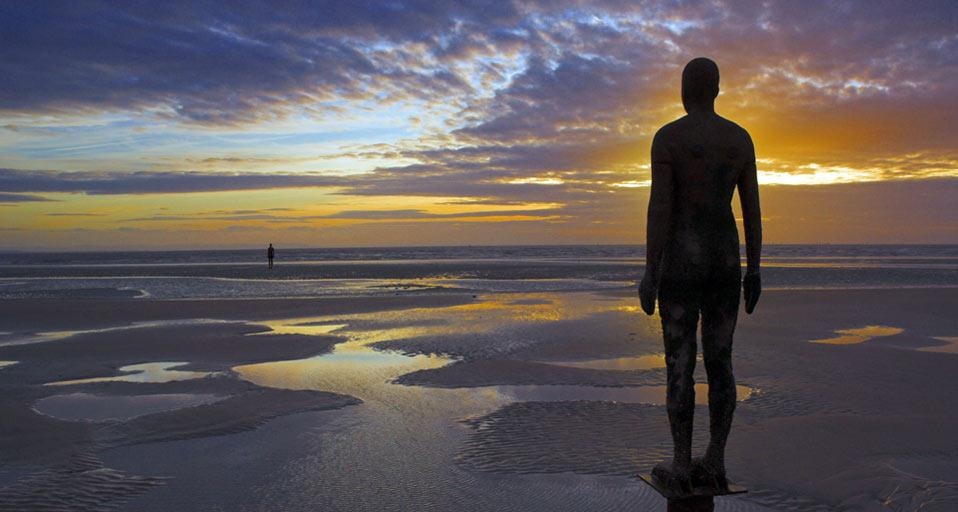 “Another Place” statues by artist Antony Gormley on Crosby Beach, Merseyside, England (© Neale Clarke/age fotostock) &copy; (Bing United States)