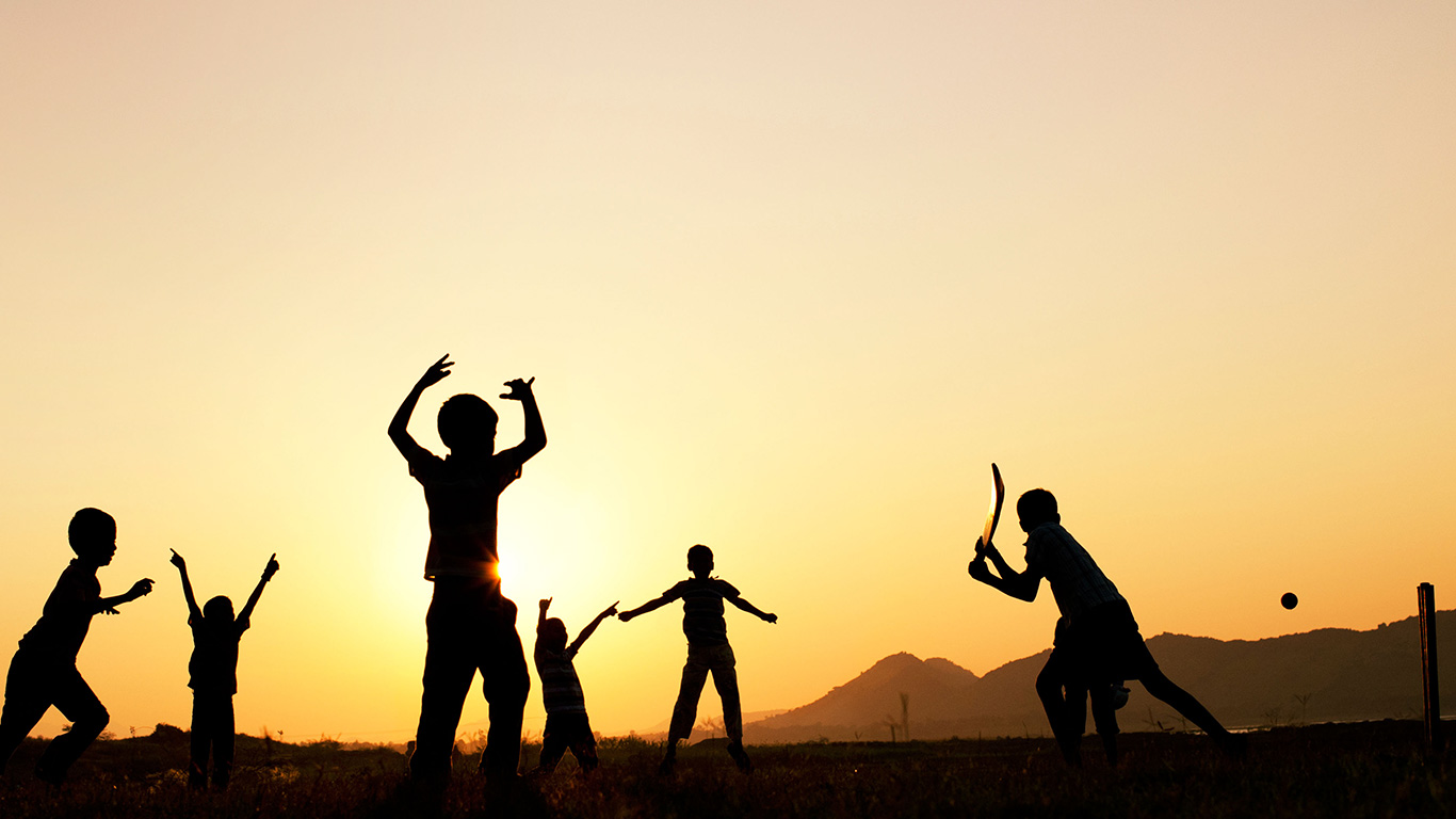 Silhouette of young Indian boys playing cricket against a sunset background (© Tim Gainey/Alamy)(Bing United Kingdom)