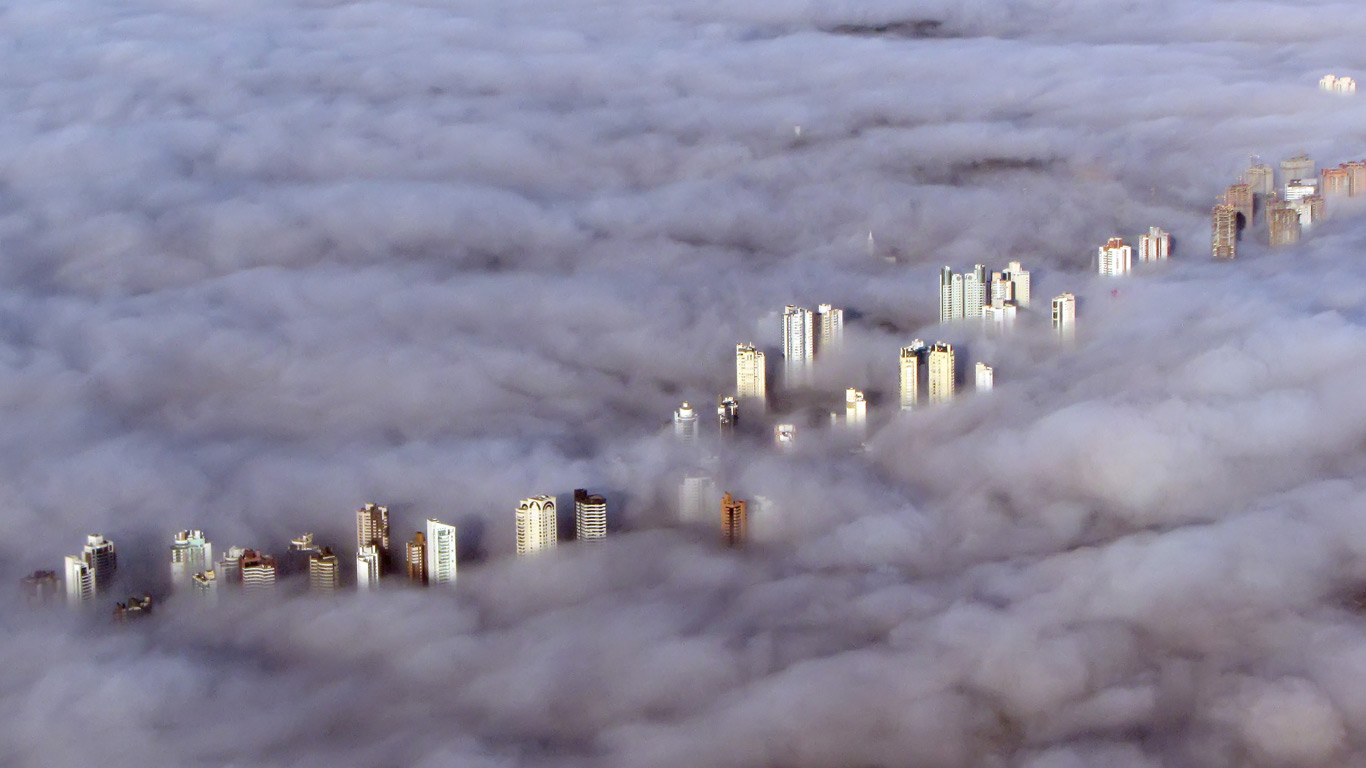 Aerial view of buildings enveloped by a thick fog in Curitiba, Brazil (© C. Quandt Photography/Getty Images)(Bing New Zealand)