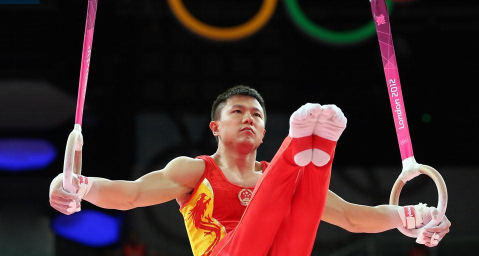 2012年7月30日伦敦北格林威治体育馆内，男子团体体操决赛中的陈一冰 (© Ronald Martinez/Getty Images) &copy; (Bing China)