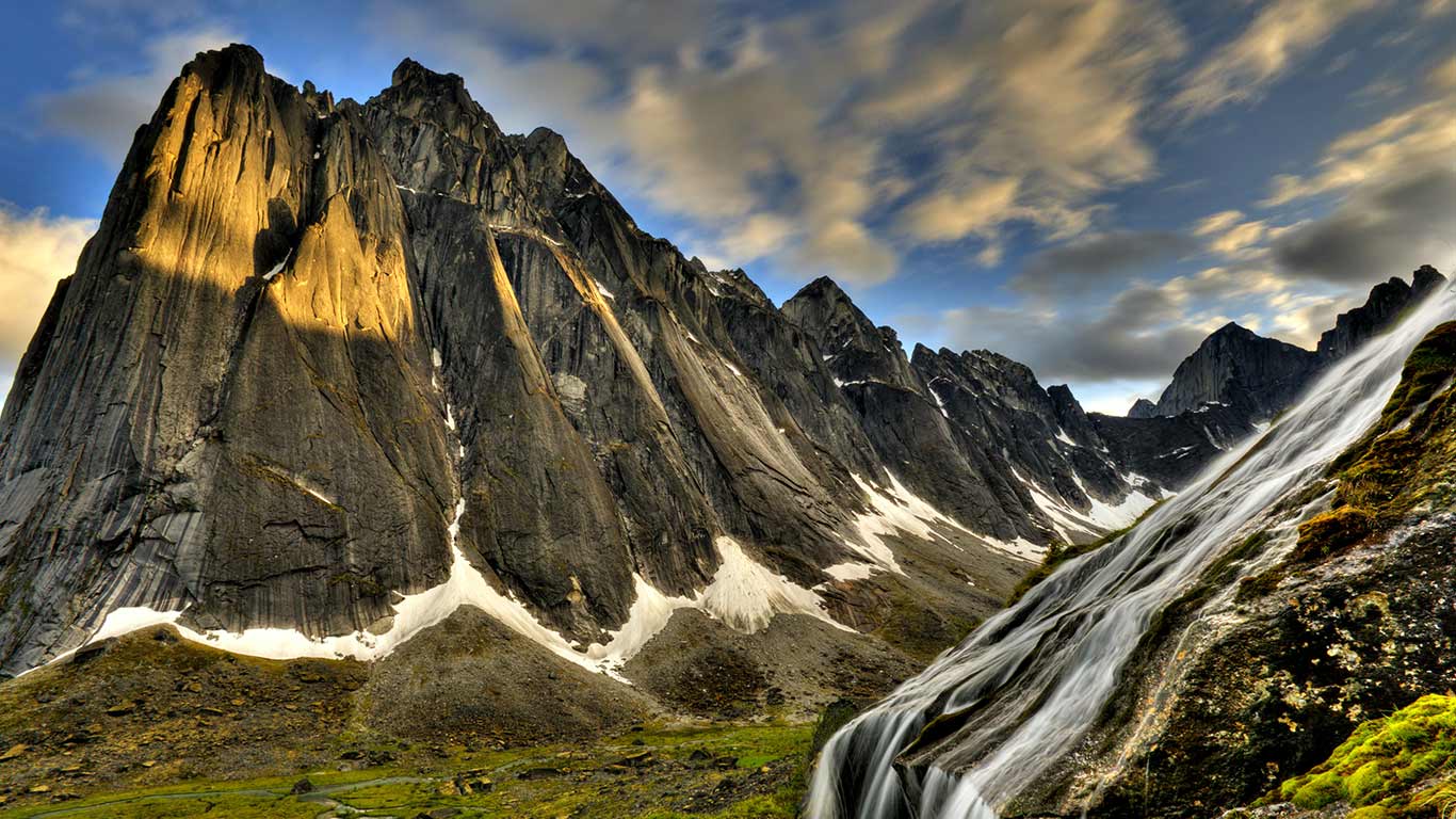 Flowing glacial creek with Mount Harrison Smith in background, Cirque of Unclimbables, Nahanni National Park, Northwest Territories (© Peter Mather/First Light/Getty Images)(Bing Canada)