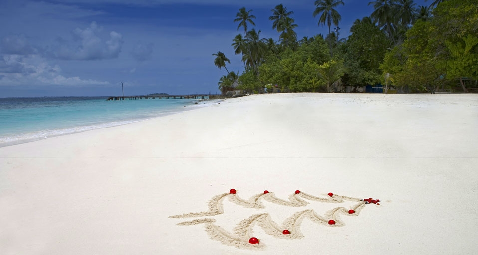 A Christmas tree outline drawn in the sand -- Angelo Cavalli/Index Stock Imagery/Photolibrary &copy; (Bing Australia)