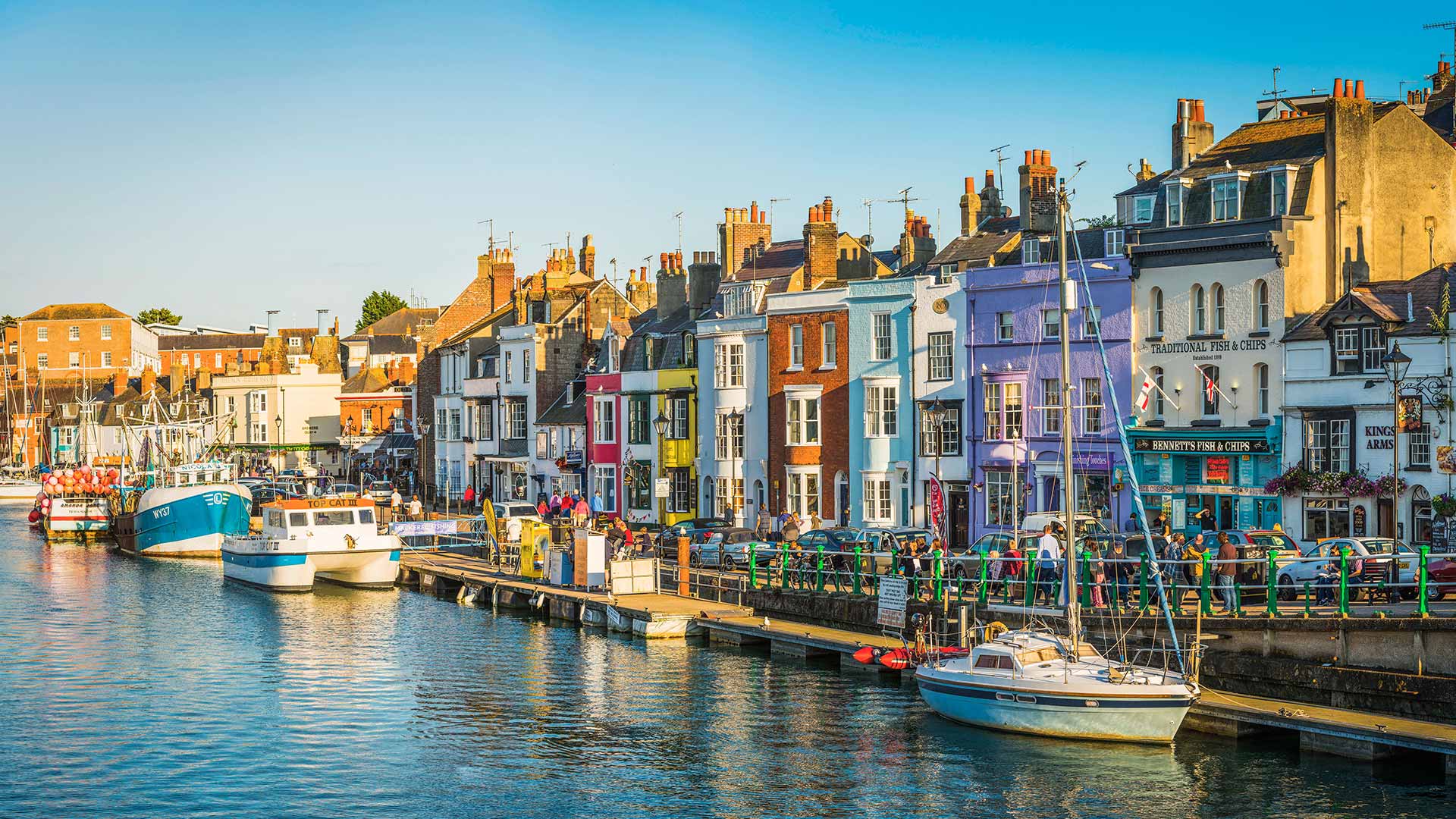 Colourful cottages, fishing boats and yachts around the harbour in Weymouth, Dorset (© fotoVoyager/Getty Images)(Bing United Kingdom)
