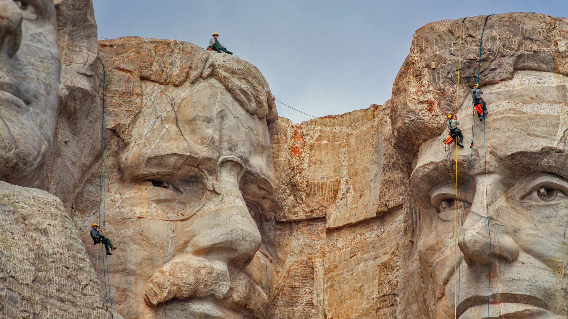 Park service employees inspecting Mount Rushmore National Memorial, South Dakota (© Universal Images Group via Getty Images)(Bing United States)