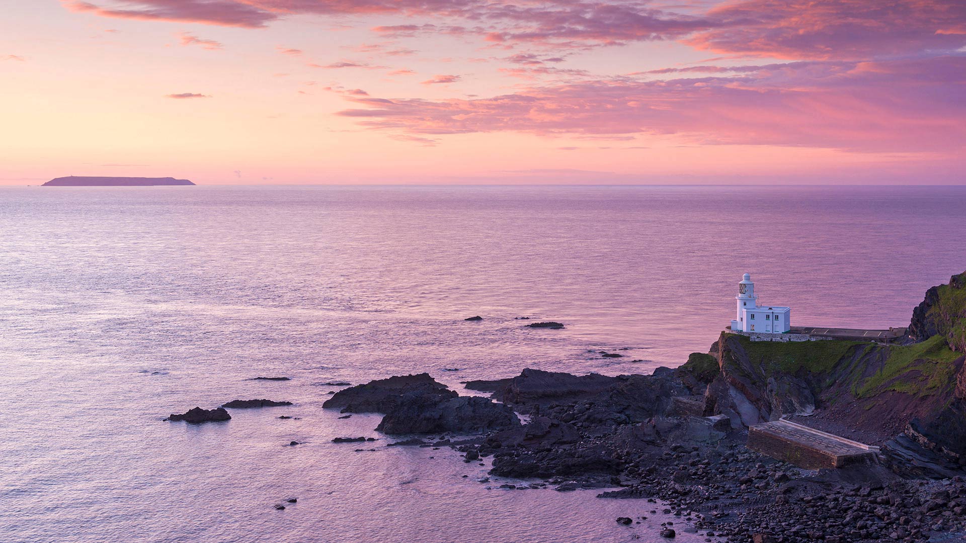 Hartland Point Lighthouse and Lundy Island beneath a colourful sunset, North Devon (© Adam Burton/Alamy Stock Photo)(Bing United Kingdom)