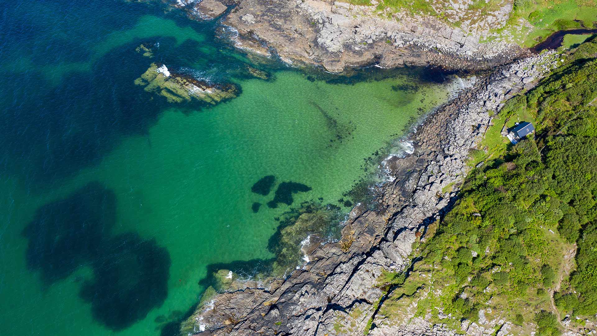 Aerial shot of waves lapping up onto rocks in Portuairk Bay, Ardnamurchan, Lochaber (© Cavan Images/Offset by Shutterstock)(Bing United Kingdom)