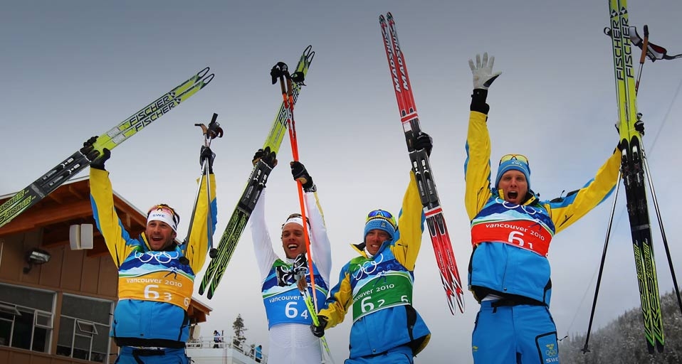 (L-R) Anders Soedergren, Marcus Hellner, Johan Olsson and Daniel Richardsson of Sweden celebrate winning the gold medal during the Men’s Cross Country 4 x 10 km relay at the 2010 Vancouver Winter Olympics on February 24, 2010 --Lars Baron/Bongarts/Getty I