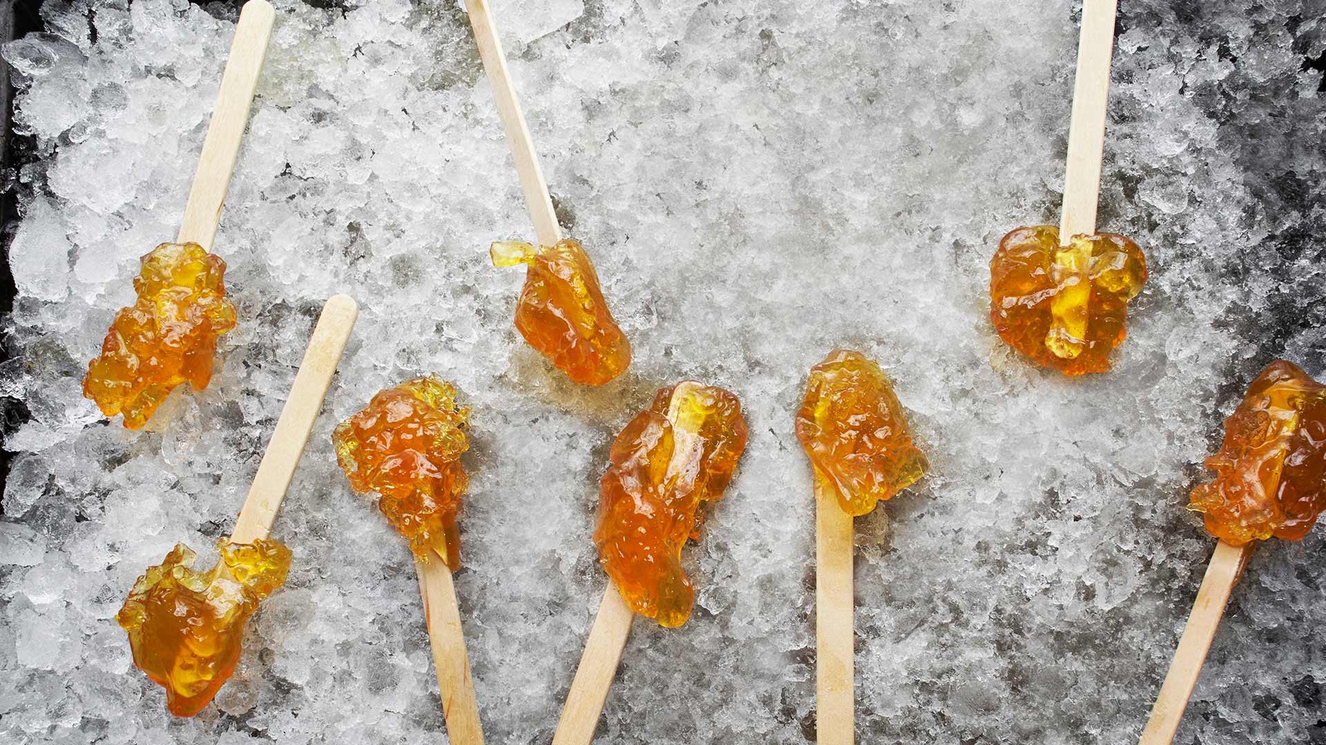 Hardened maple syrup on a wooden stick sitting on ice, Elmira, Ontario (© Design Pics/Offset/Shutterstock)(Bing Canada)