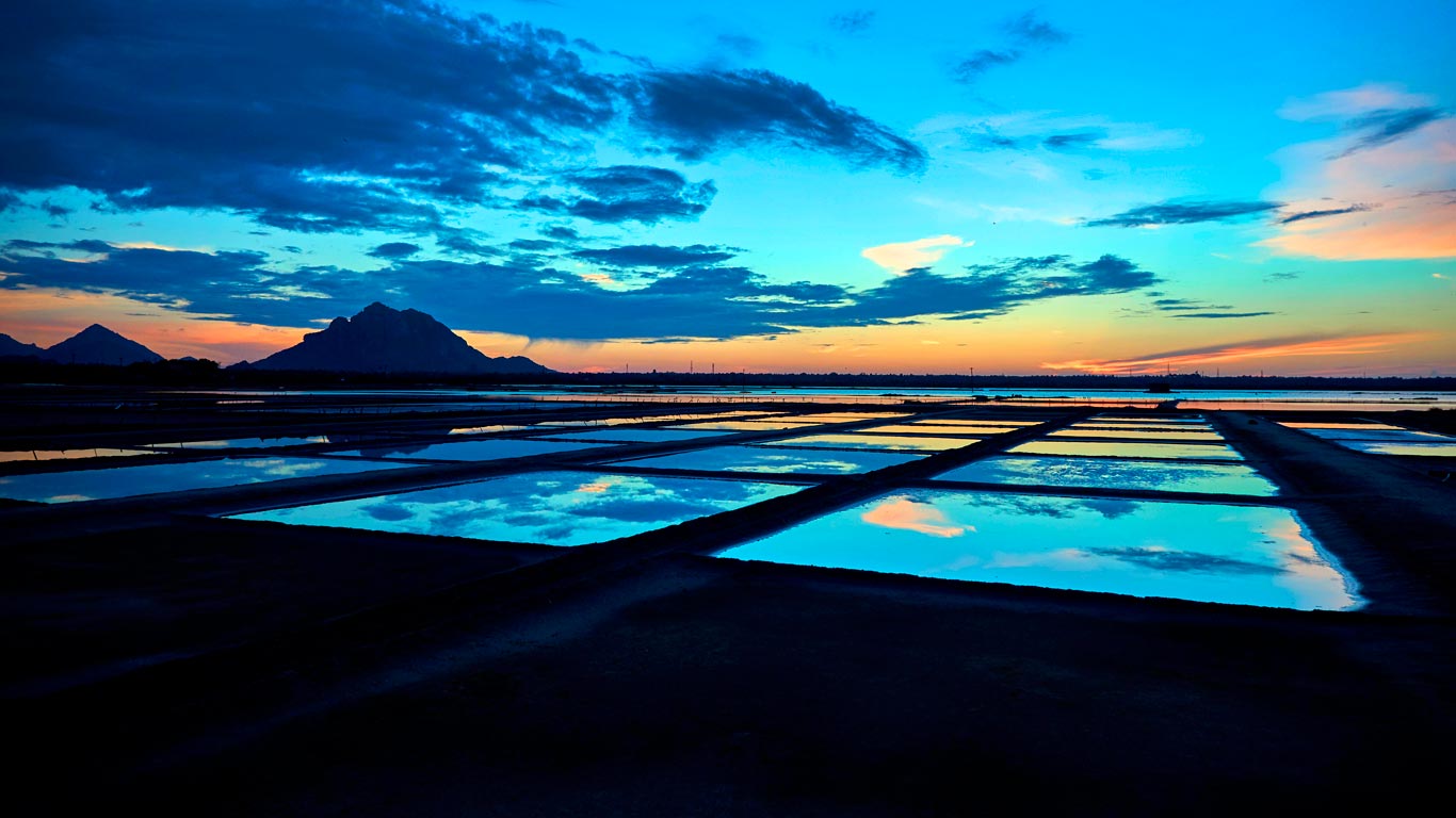 Sunset over salt pans in Tamil Nadu, India (© Pradeep Soman/Alamy)(Bing New Zealand)