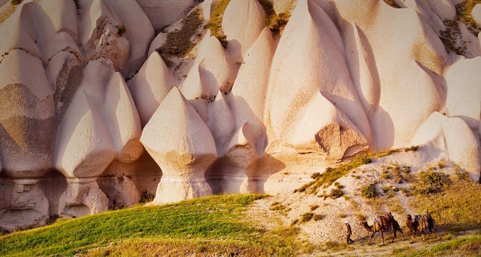 Eroded rock formations and camels in Uchisar, Cappadocia, Turkey -- Marc Dozier/Corbis &copy; (Bing Canada)