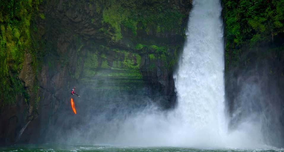 A man rappels down a huge cliff next to a waterfall on the Rio Alseseca in the state of Veracruz, Mexico -- Lucas Gilman/Aurora Photos &copy; (Bing Canada)