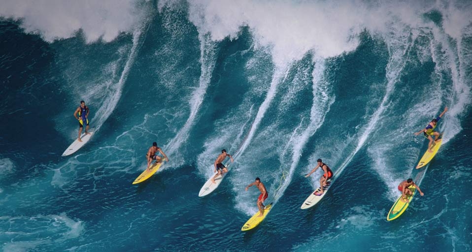 Surfers riding large wave, Hawaii -- Warren Bolster/Stone/Getty Images &copy; (Bing United States)