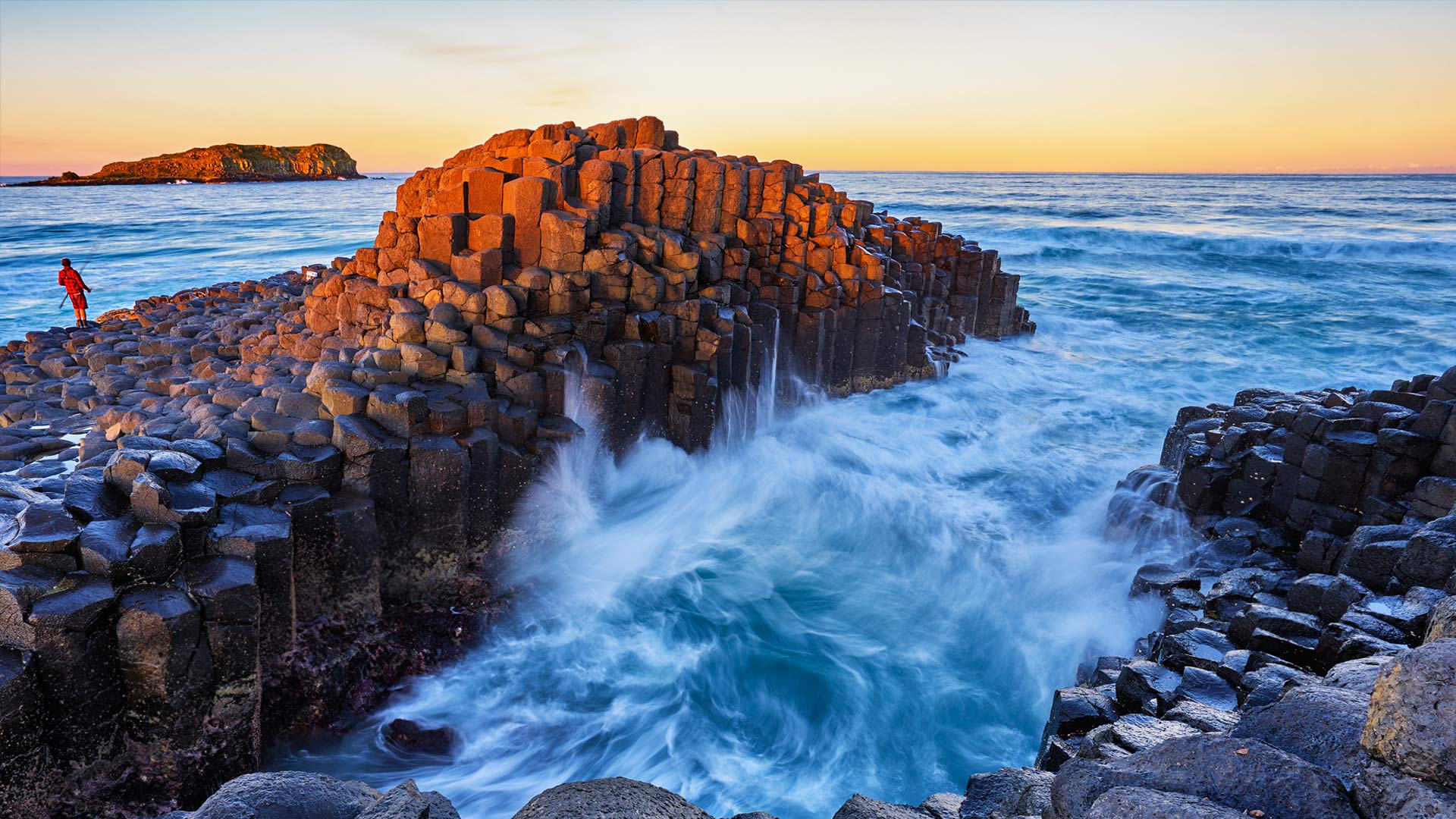 Fingal Head with a rock fisherman on the headland (© Auscape/UIG via Getty Images)(Bing Australia)