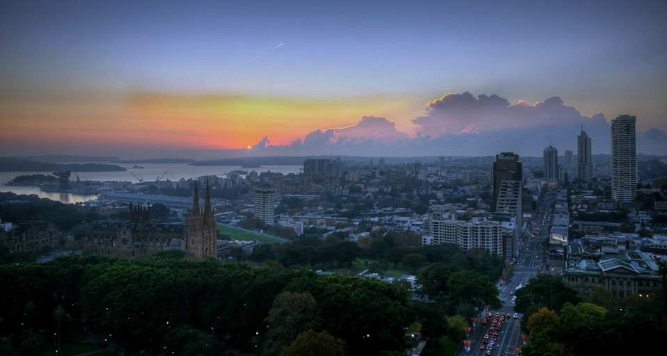 The first rays of sun pouring through a cloud formation over eastern Sydney, Australia -- Tao van de Graaff/Flickr/Getty Images &copy; (Bing Australia)