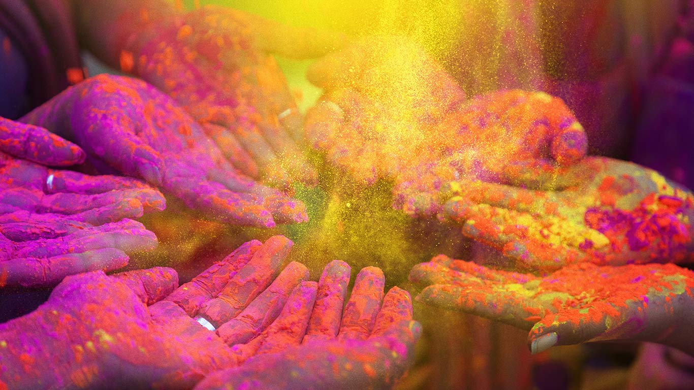 People celebrating Holi festival in India (© Peter Zelei/Getty Images)(Bing Canada)