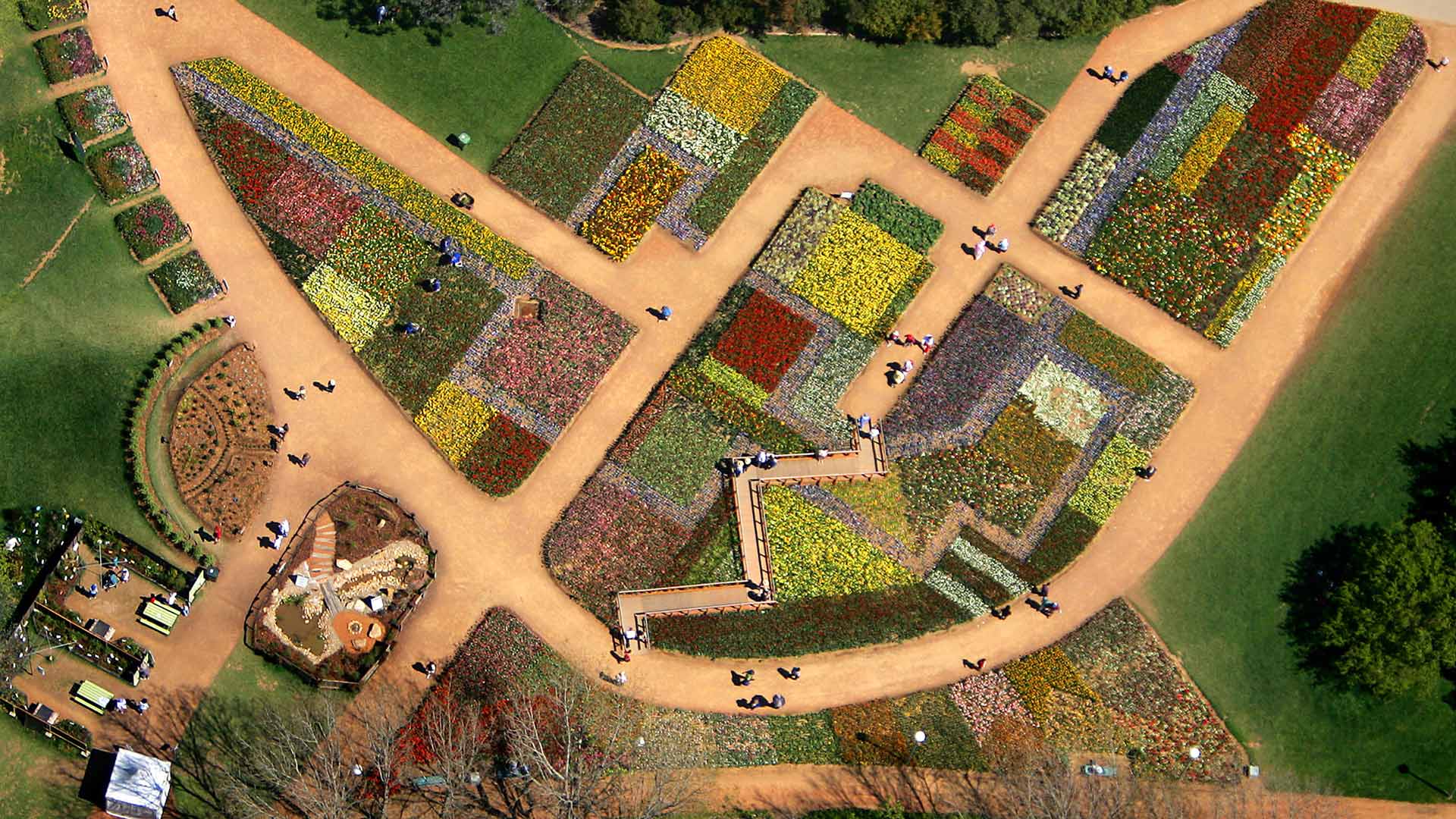 Tourists walk on pathways through a flowerbed design known as ‘The Australian Billabong’ at the Floriade flower festival in Canberra (© REUTERS/TimWimborne)(Bing Australia)