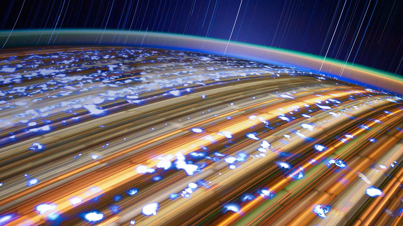 从国际空间站上拍摄的星流和地球图片 (© NASA/JSC/Science Photo Library)(Bing China)