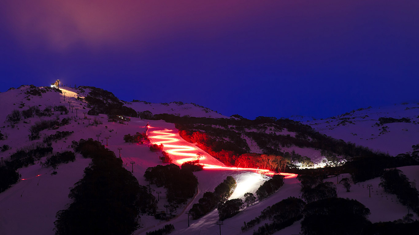 Skier with red torch at dusk in Thredbo, New South Wales (© Taras Vyshnya/Shutterstock)(Bing Australia)