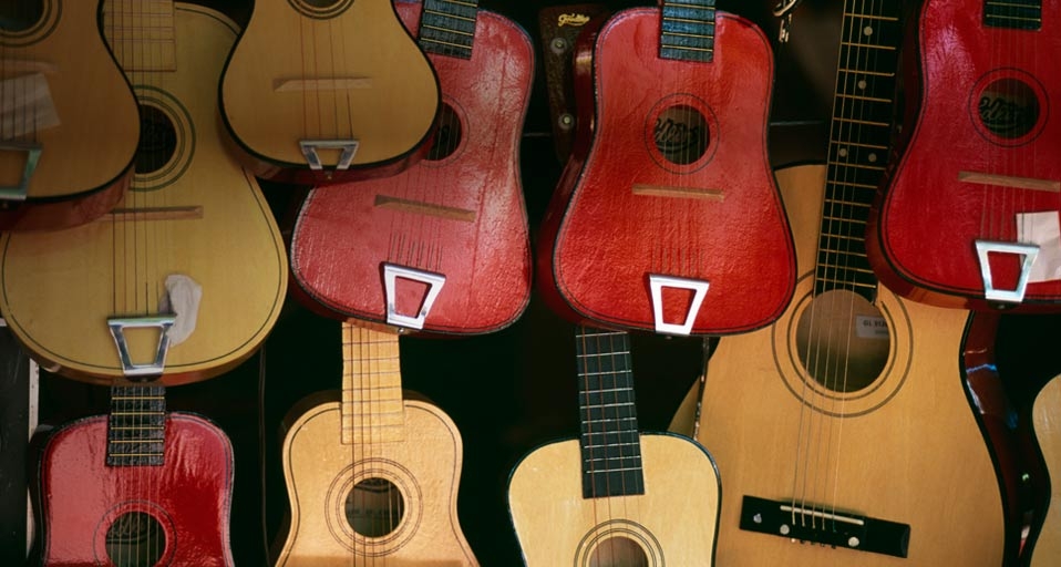 Guitars hanging on a wall -- Ray Laskowitz/PureStock/age fotostock &copy; (Bing Australia)