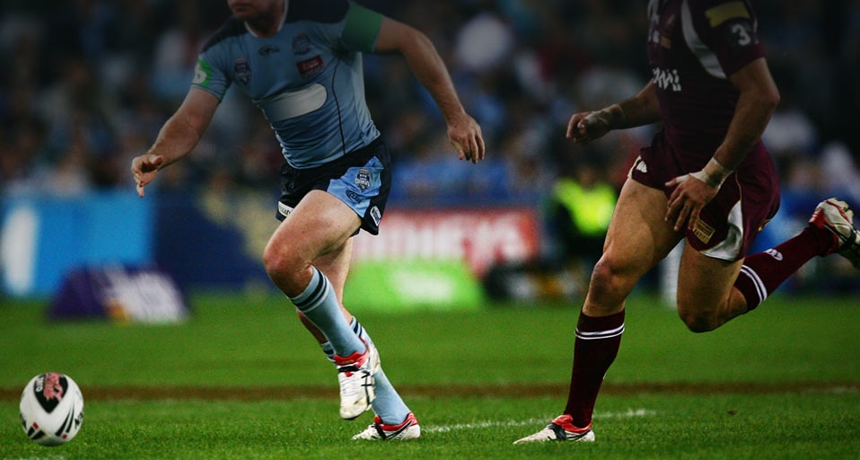 Two players chase the ball during a game of the NRL State of Origin series at ANZ Stadium in Sydney, Australia in 2009 -- Matt King/Getty Images &copy; (Bing Australia)