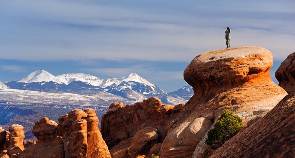 The snow-capped La Sal Mountains behind sandstone pinnacles at Devils Garden in Arches National Park, Utah, U.S.A. (© Christian Kober/Aurora Photos) &copy; (Bing Canada)