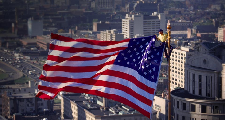Flag rigger on flagpole, Boston, Massachusetts (© John Burke/Photolibrary) &copy; (Bing United States)