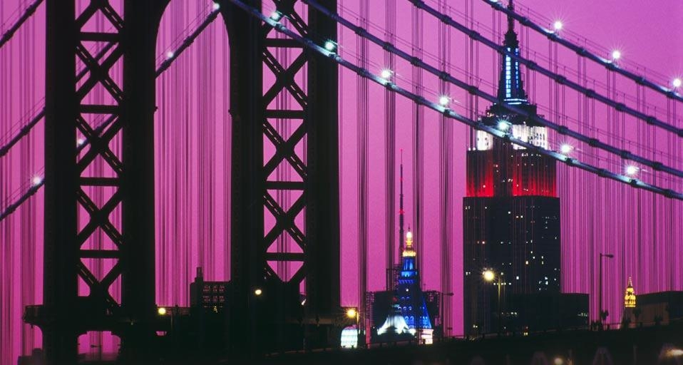 Manhattan Bridge and the Empire State Building illuminated with red, white, and blue lights in New York City, New York (© age fotostock/SuperStock) &copy; (Bing United States)