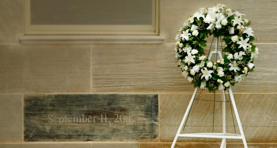 A wreath is placed next to a memorial stone, charred in the 9/11 attack, at the Pentagon in Washington, D.C. -- Shawn Thew/Corbis &copy; (Bing United States)