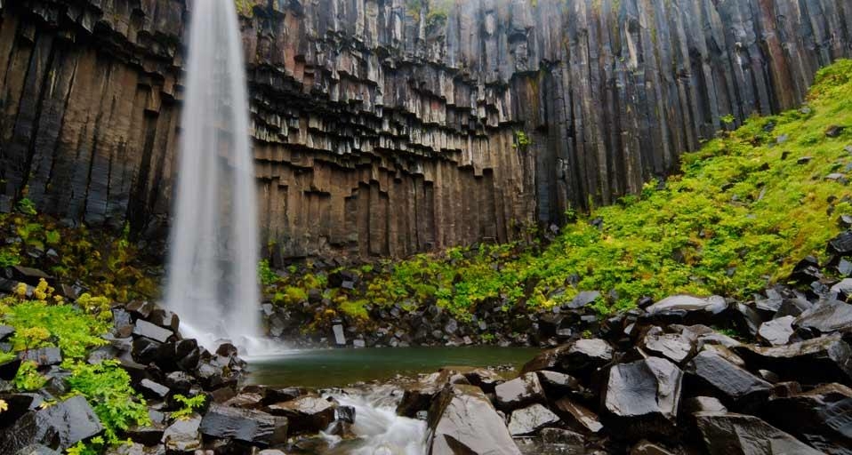 Svartifoss waterfall flanked by hexagonal basalt columns in Vatnajökull National Park, Iceland (© Martin Moos/Lonely Planet Images) &copy; (Bing Canada)