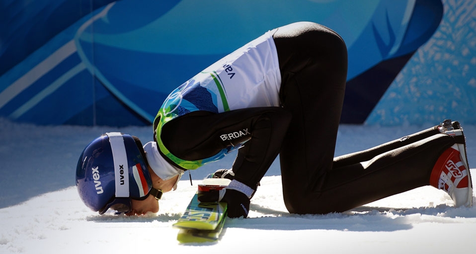 Adam Malysz of Poland kisses the ground after jumping the Large Hill at the 2010 Vancouver Winter Olympics on February 20, 2010 -- Alexander Hassenstein/Bongarts/Getty Images &copy; (Bing United States)